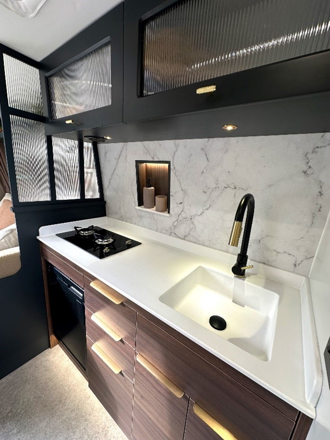 The solid surface brings seamless design and durability to deluxe campervans
