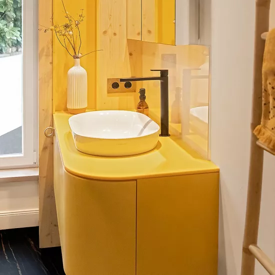 Pretty in Pink: HIMACS in Ruby crowns a contemporary kitchen  – and Banana yellow brightens up a bathroom