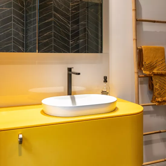 Pretty in Pink: HIMACS in Ruby crowns a contemporary kitchen  – and Banana yellow brightens up a bathroom