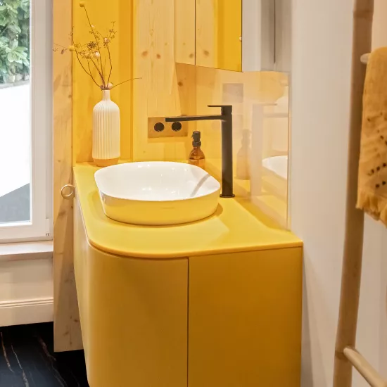 Pretty in Pink: HIMACS in Ruby crowns a contemporary kitchen  – and Banana yellow brightens up a bathroom