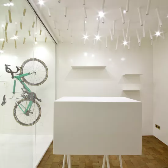 The interior  of a bike & coffee shop featuring HIMACS