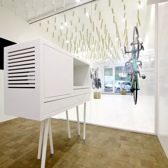 The interior  of a bike & coffee shop featuring HIMACS