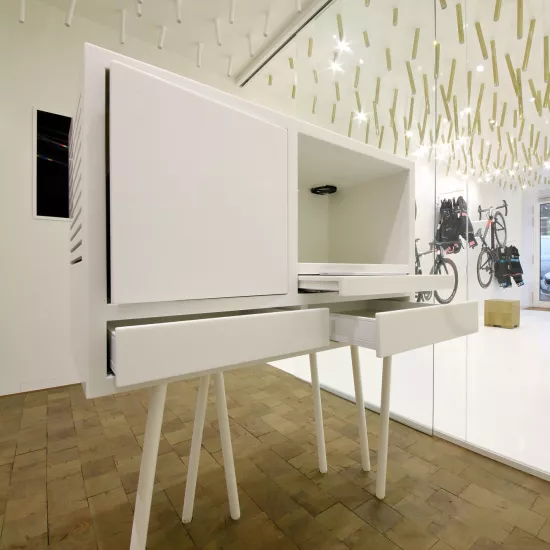 The interior  of a bike & coffee shop featuring HIMACS