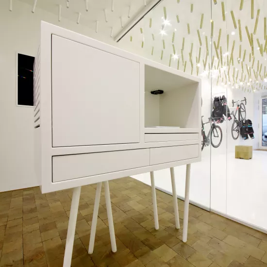 The interior  of a bike & coffee shop featuring HIMACS