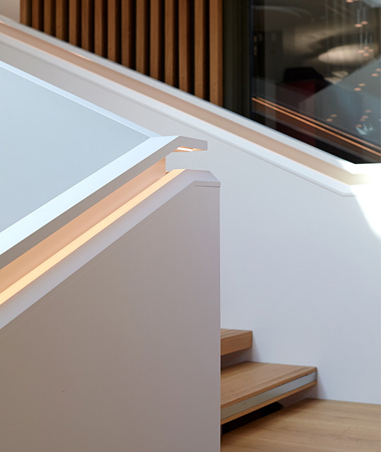 Cmma Headquarter staircase designed with oak and HIMACS solid surface