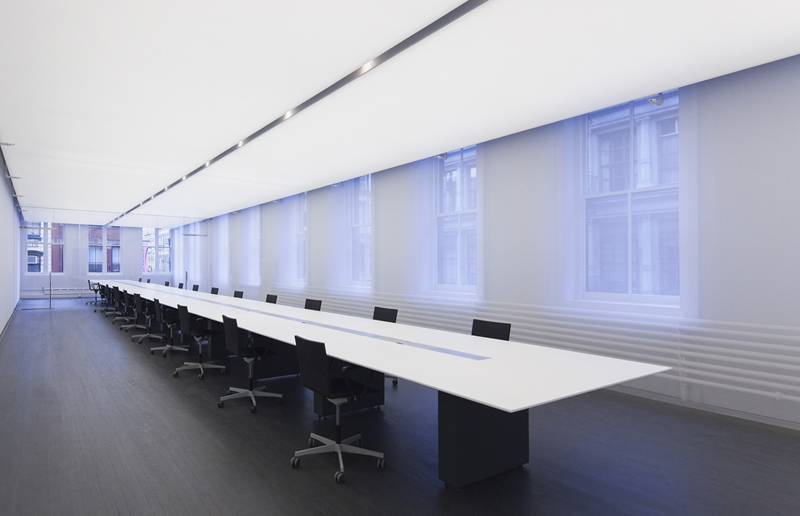 Long conference room table by white HIMACS solid surface material