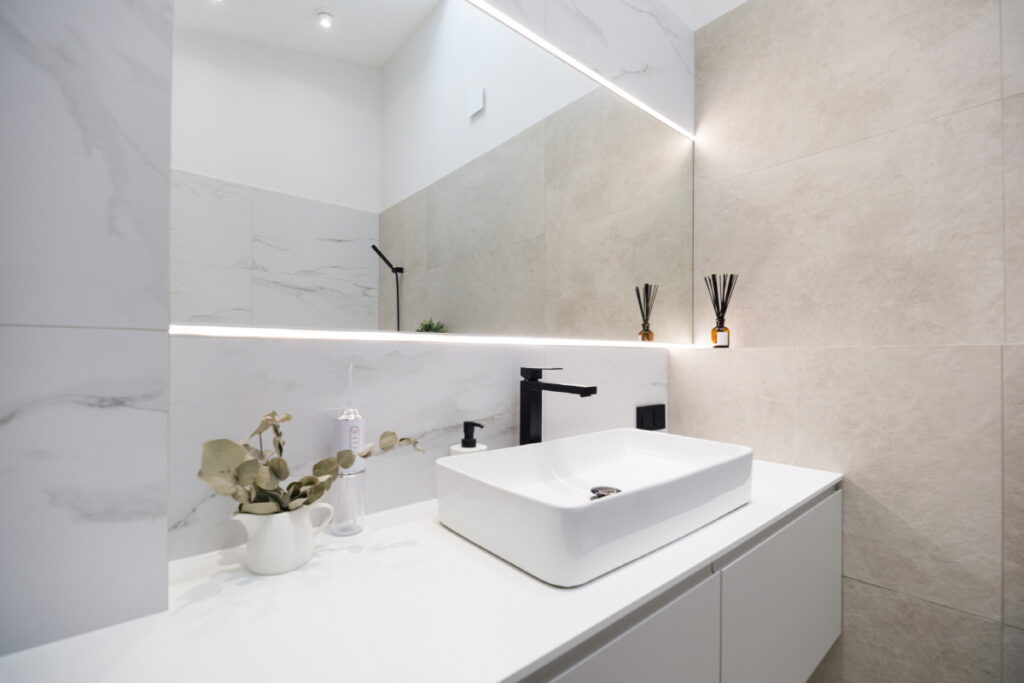 Bathroom interior design with white laminate vanity top