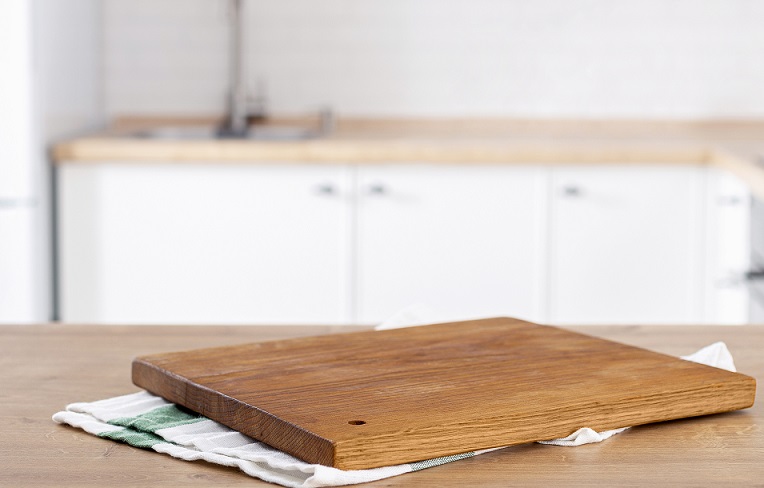 It's easy to drill holes or add details to hang wooden cutting boards from the wall.