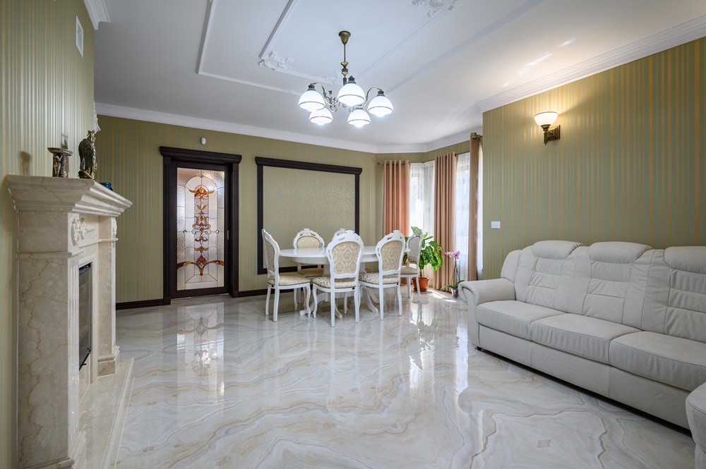 Elegant European-inspired homes favor light marble and stone-look flooring for sophistication.