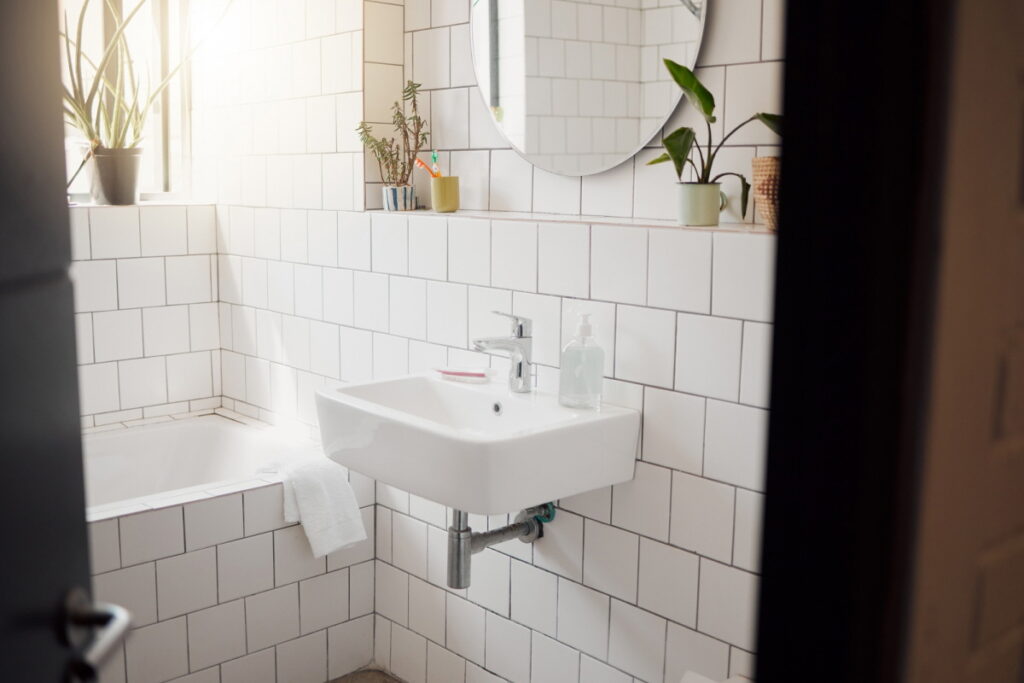 Small bathrooms benefit from ceramic, mosaic, or wood plank tiles, expanding space and enhancing style.