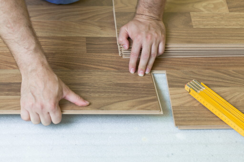 Laminate has an HDF core, photographic visuals, and DIY-friendly click-and-lock installation.