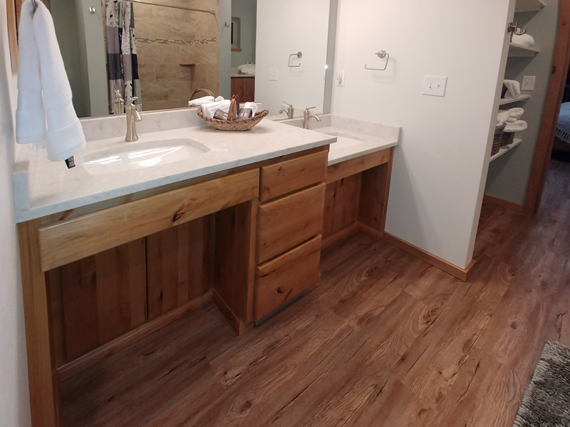 Maximize space in a small powder room by adding creative storage under the sink with baskets or shelves.