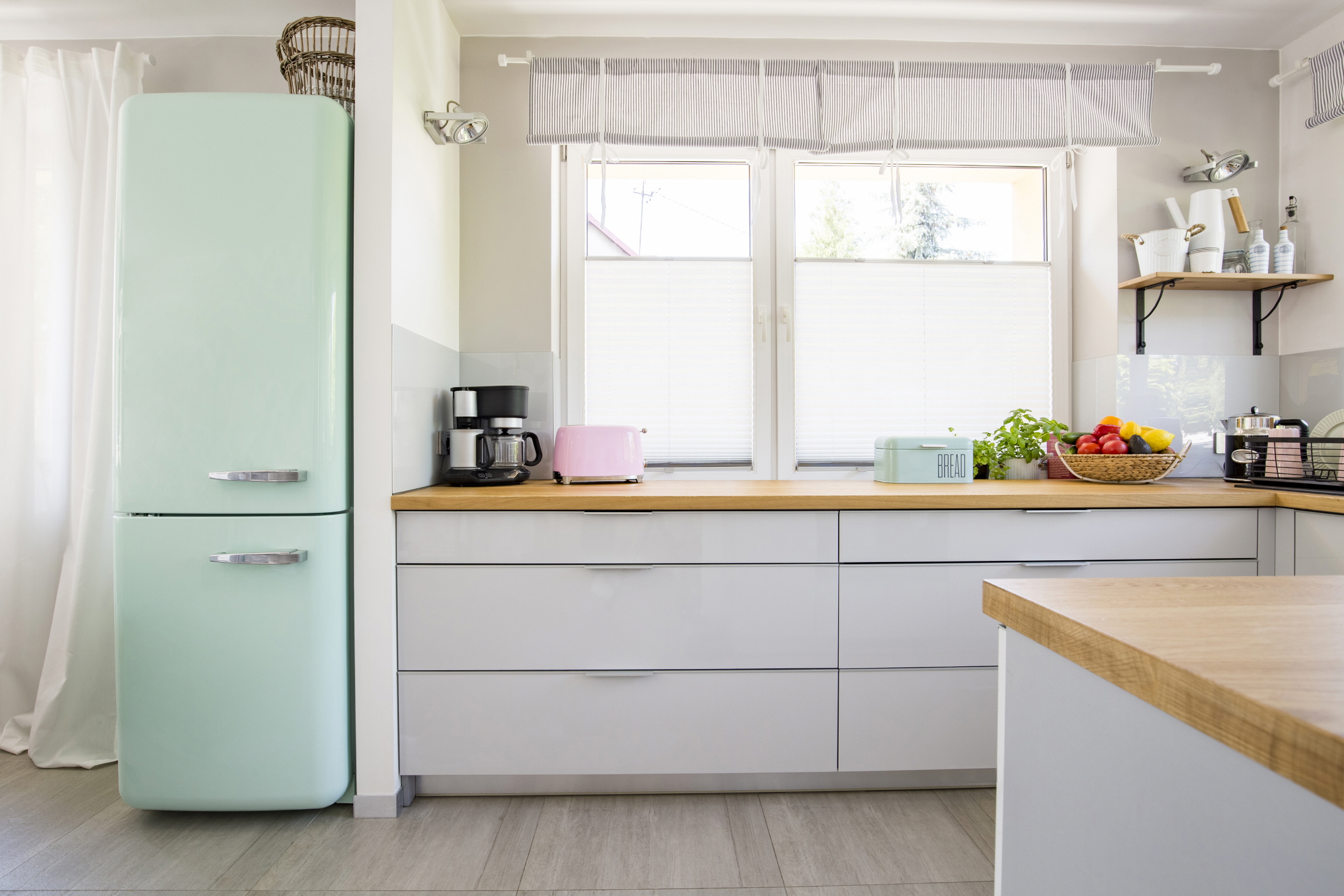 Elevate your small kitchen with colorful or retro-inspired appliances for a bold statement.