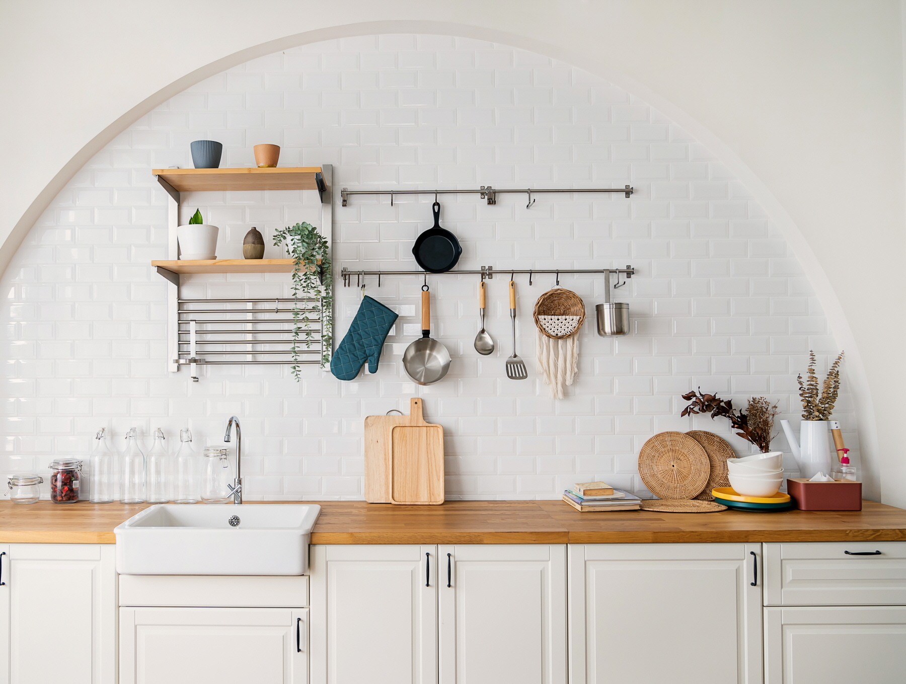 Maximize space in a small kitchen with ceiling storage like hanging racks, freeing up cabinets and adding visual interest.