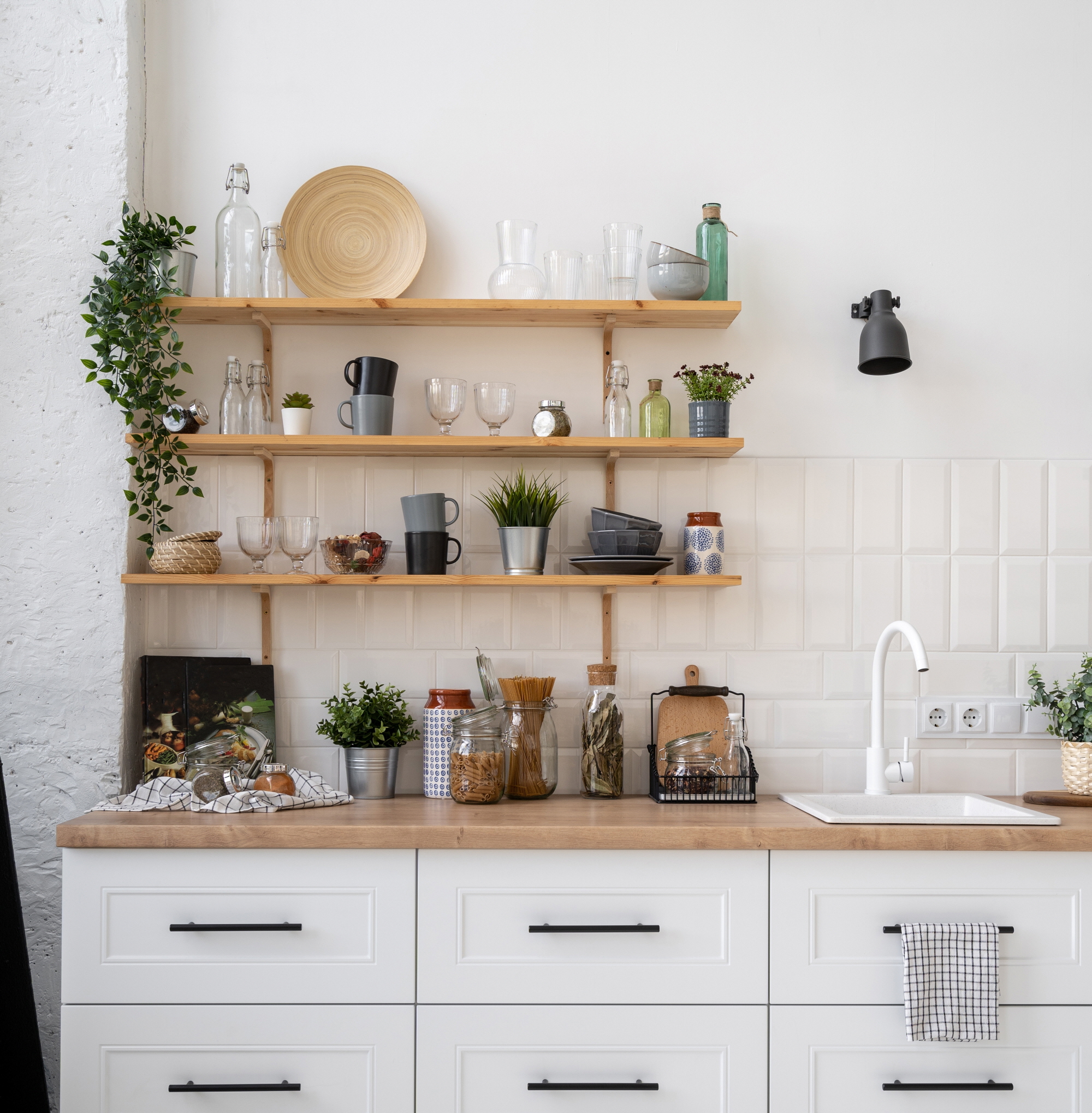 Revamp your kitchen with budget-friendly open shelving. Display essentials creatively, ditching costly cabinets for trendy, personalized flair.