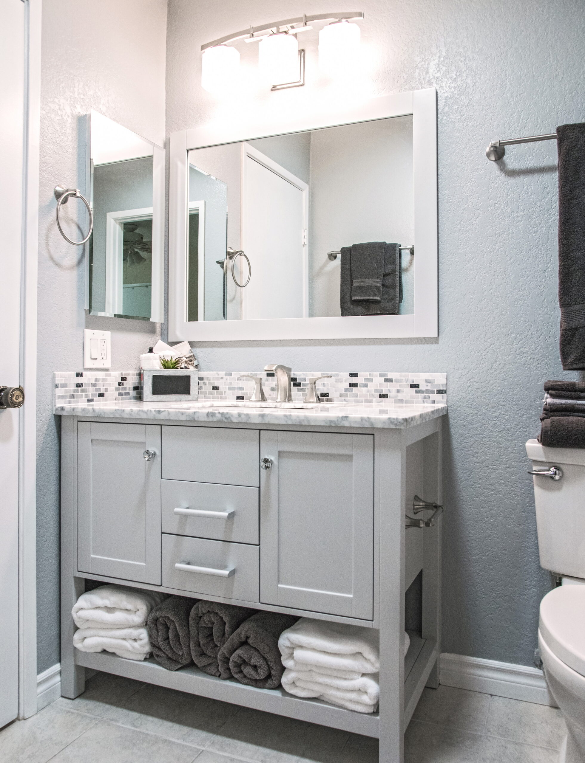 Use space efficiently while complementing your design with a vanity or cabinet with.
