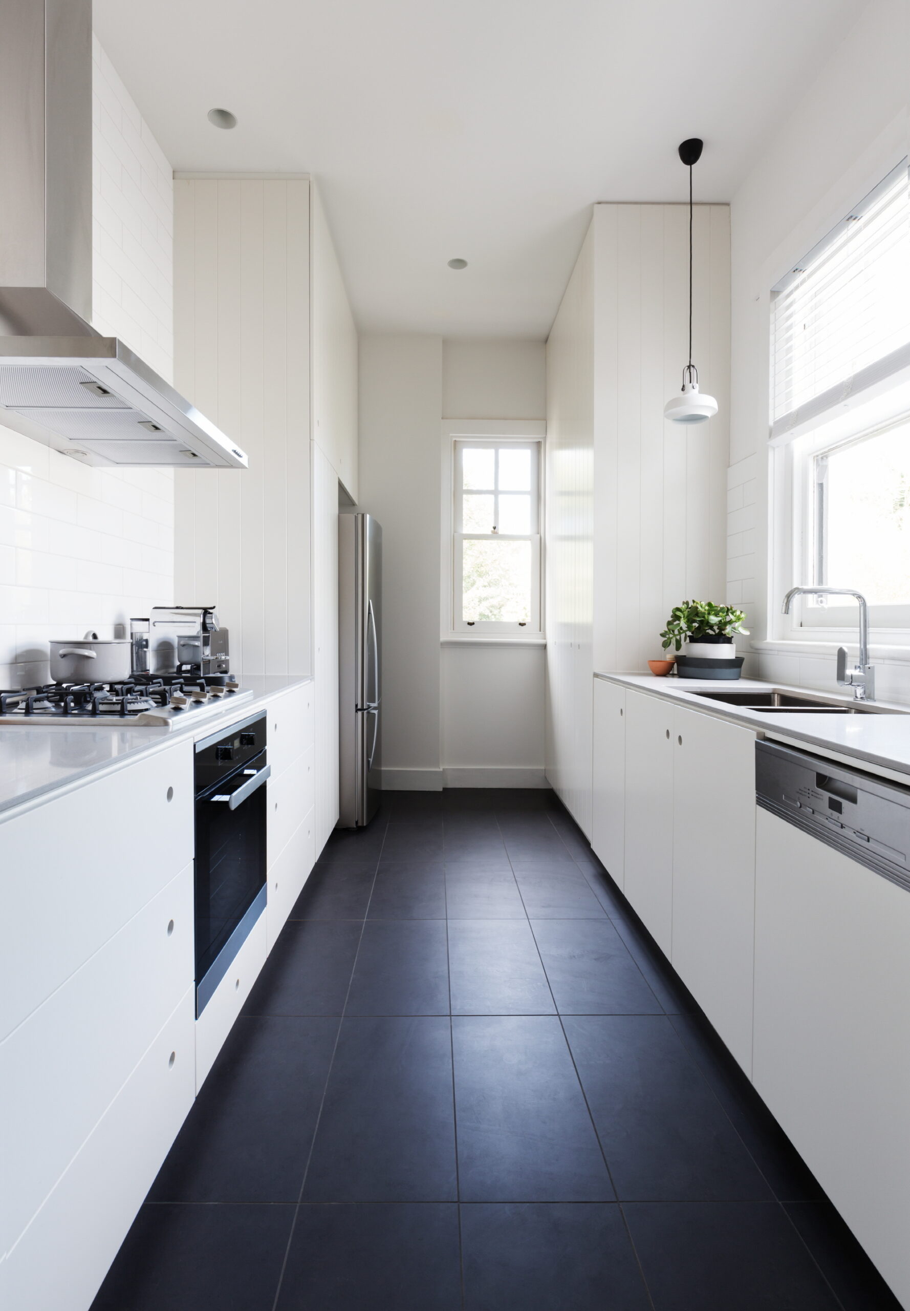 Opt for a timeless black and white kitchen with a large tile floor to evoke a classic and historic ambiance.
