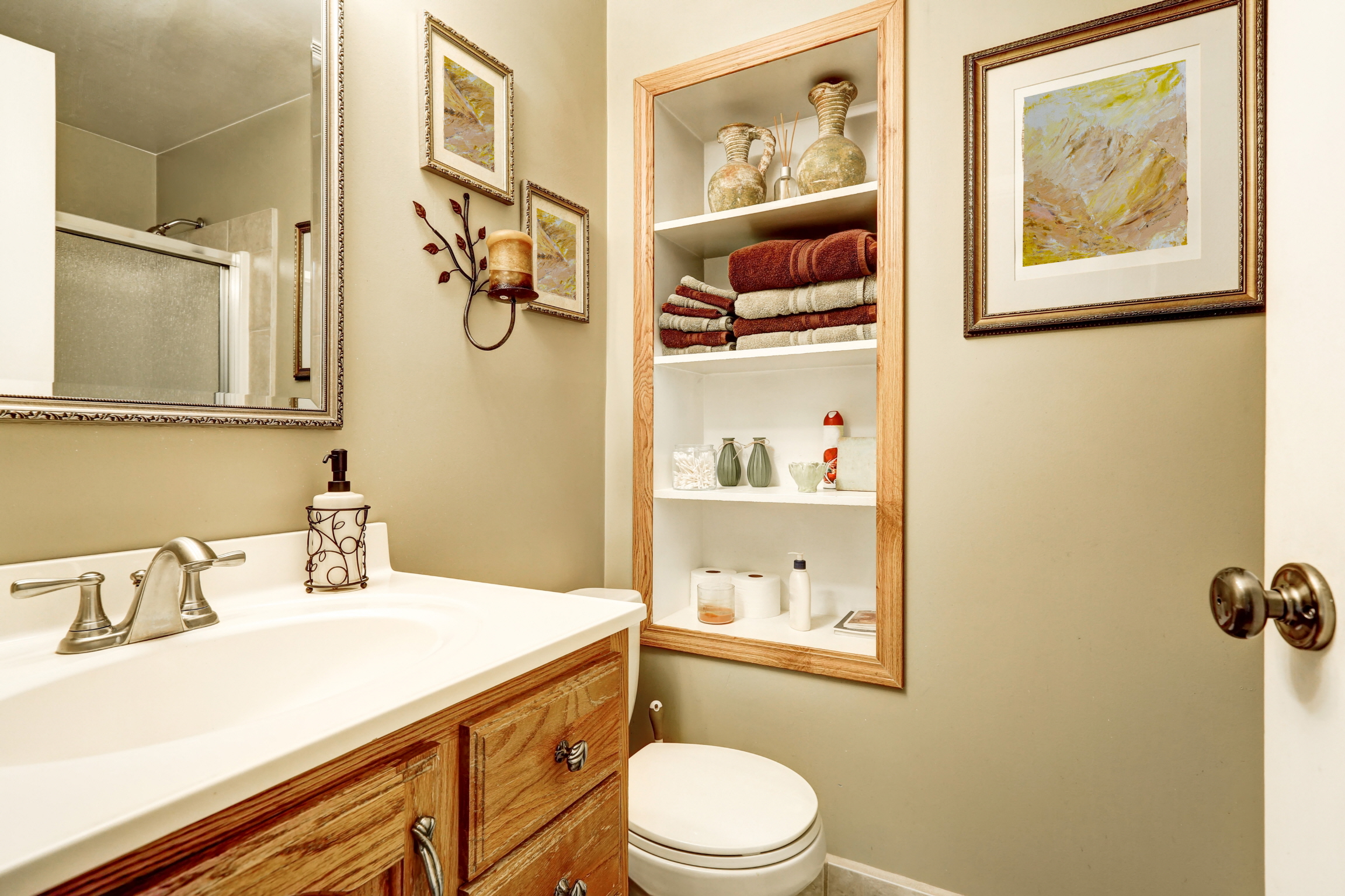 Ensure guest convenience with ample storage options in the guest bathroom, like drawers, cabinets, or shelves, for easy access to essentials.
