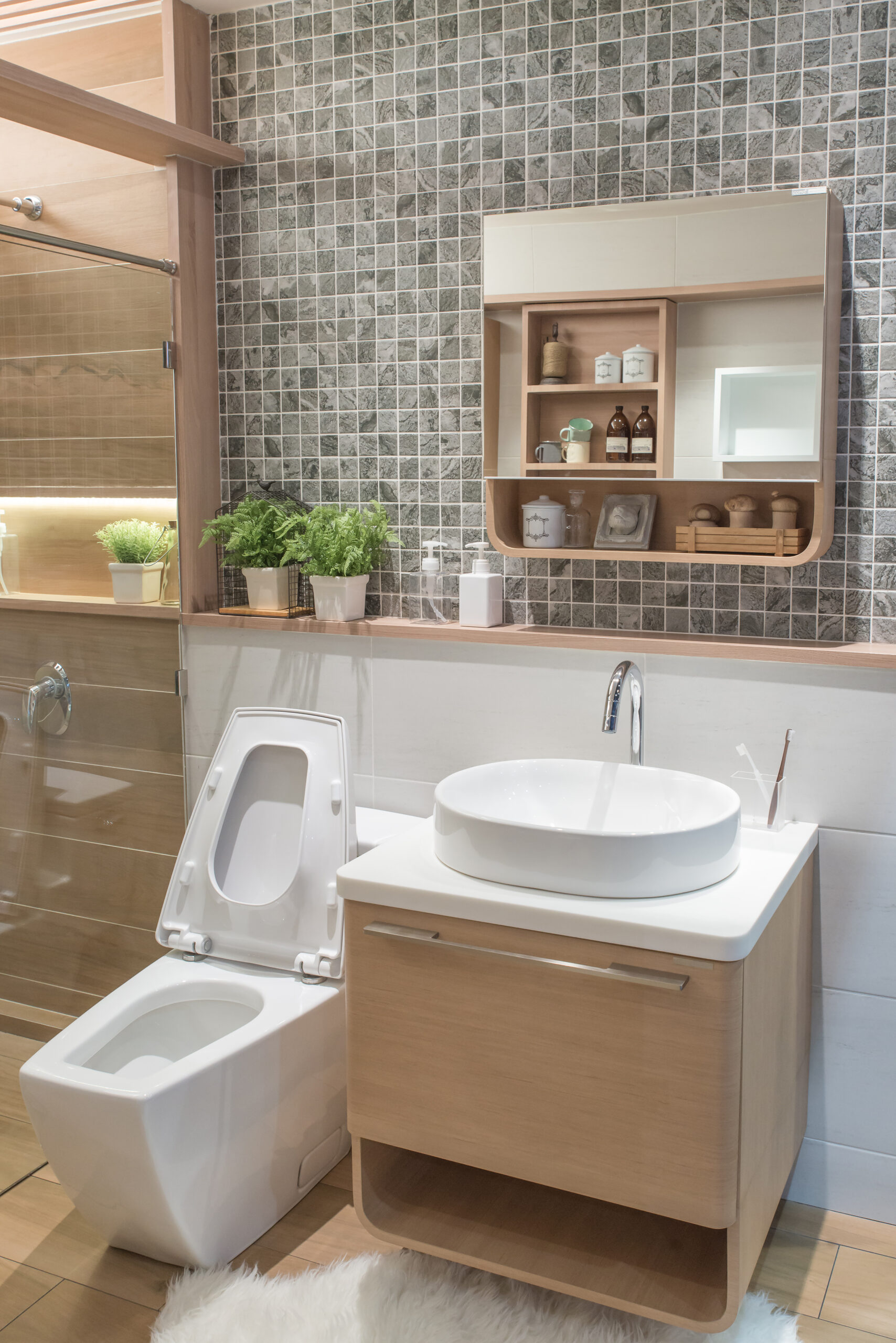 A wall-mounted sink with attached shelves offers both functionality and space-saving benefits in a small bathroom.