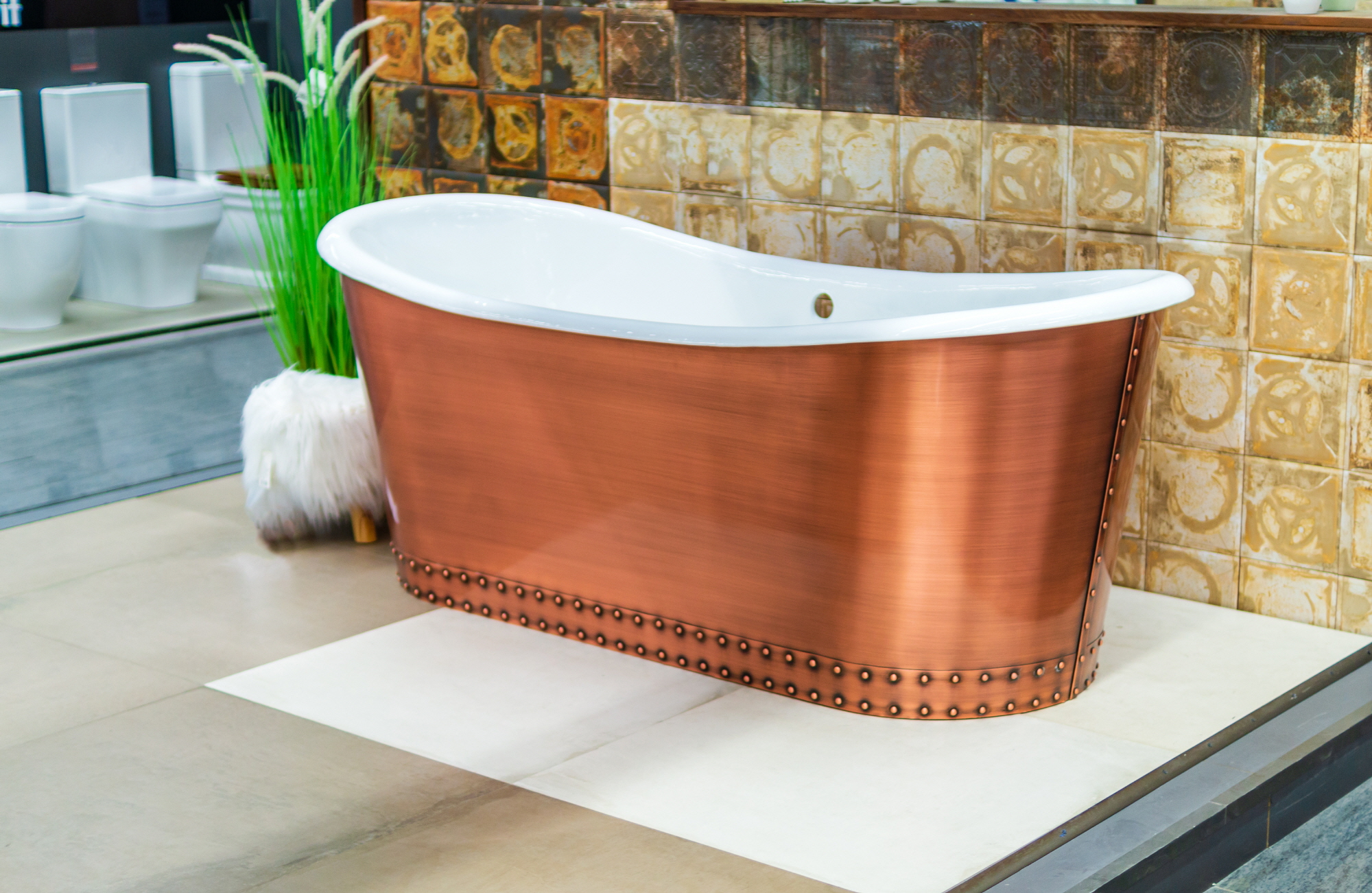 Indulge in luxury with a stunning freestanding copper bathtub, paired with metallic fixtures for a lavish touch.