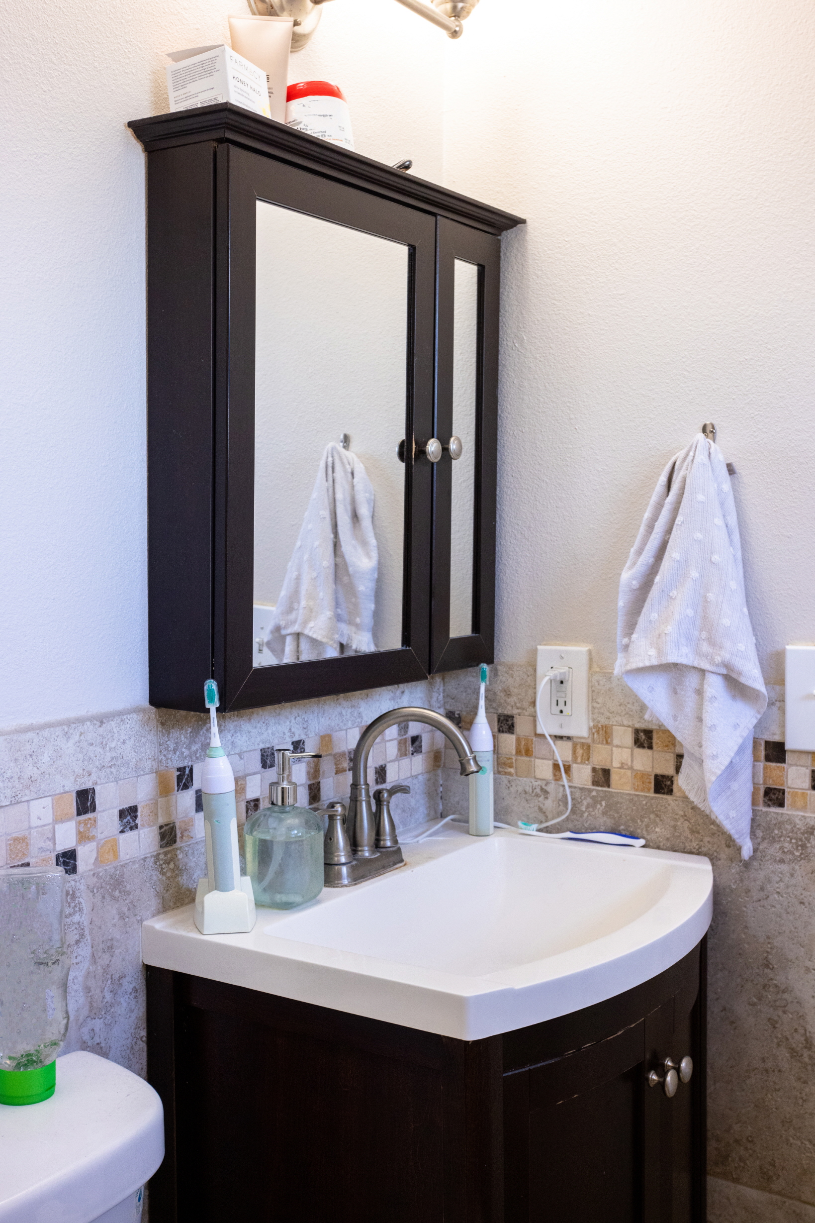 Use drawer organizers for neat bathroom vanity storage.