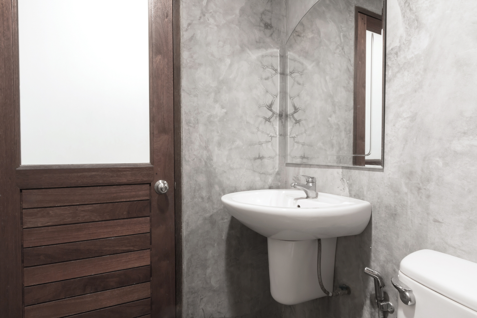 Corner vanities save space in small bathrooms by fitting neatly into corners.