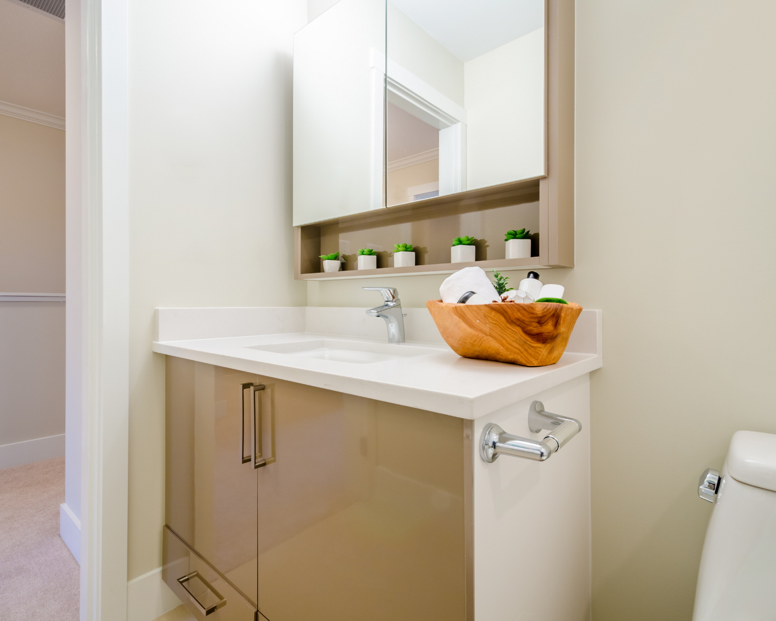 Optimize storage in your small bathroom with a mirror that has hidden storage for toiletries and medicine bottles.