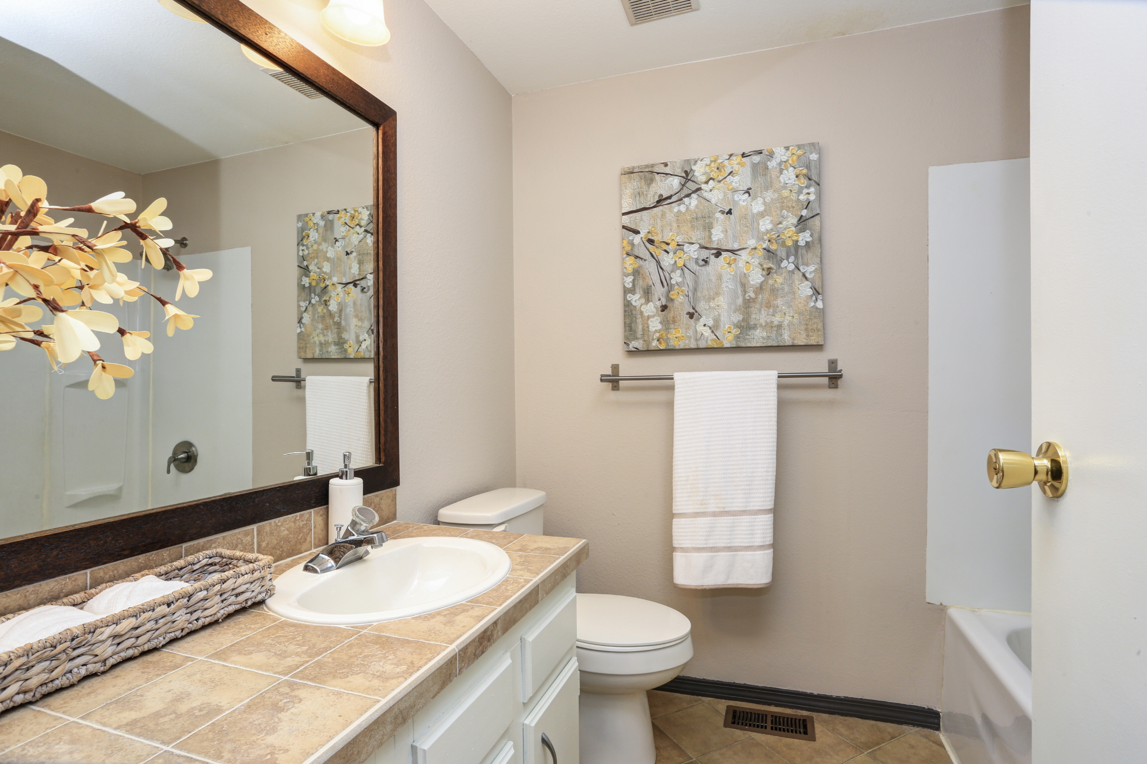 Create a gallery-like bathroom with framed artwork and photos in various sizes and styles to reflect your taste.