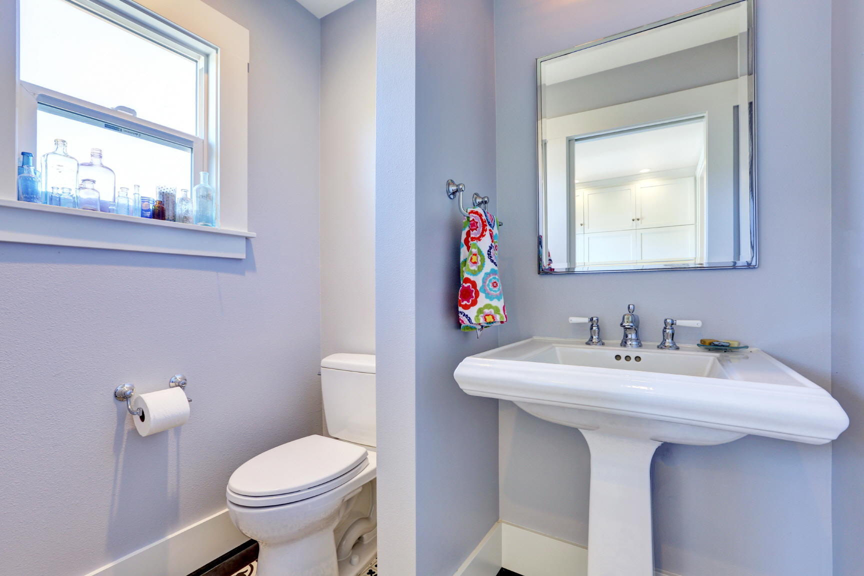 Pale blue makes small bathrooms feel spacious and soothing. Add white trim and natural elements for a relaxed vibe.