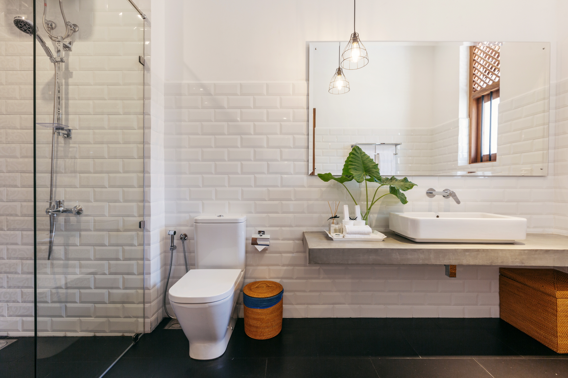 Reduce the complexity of your renovation and create a clean look by placing the sink and toilet on the same wall.
