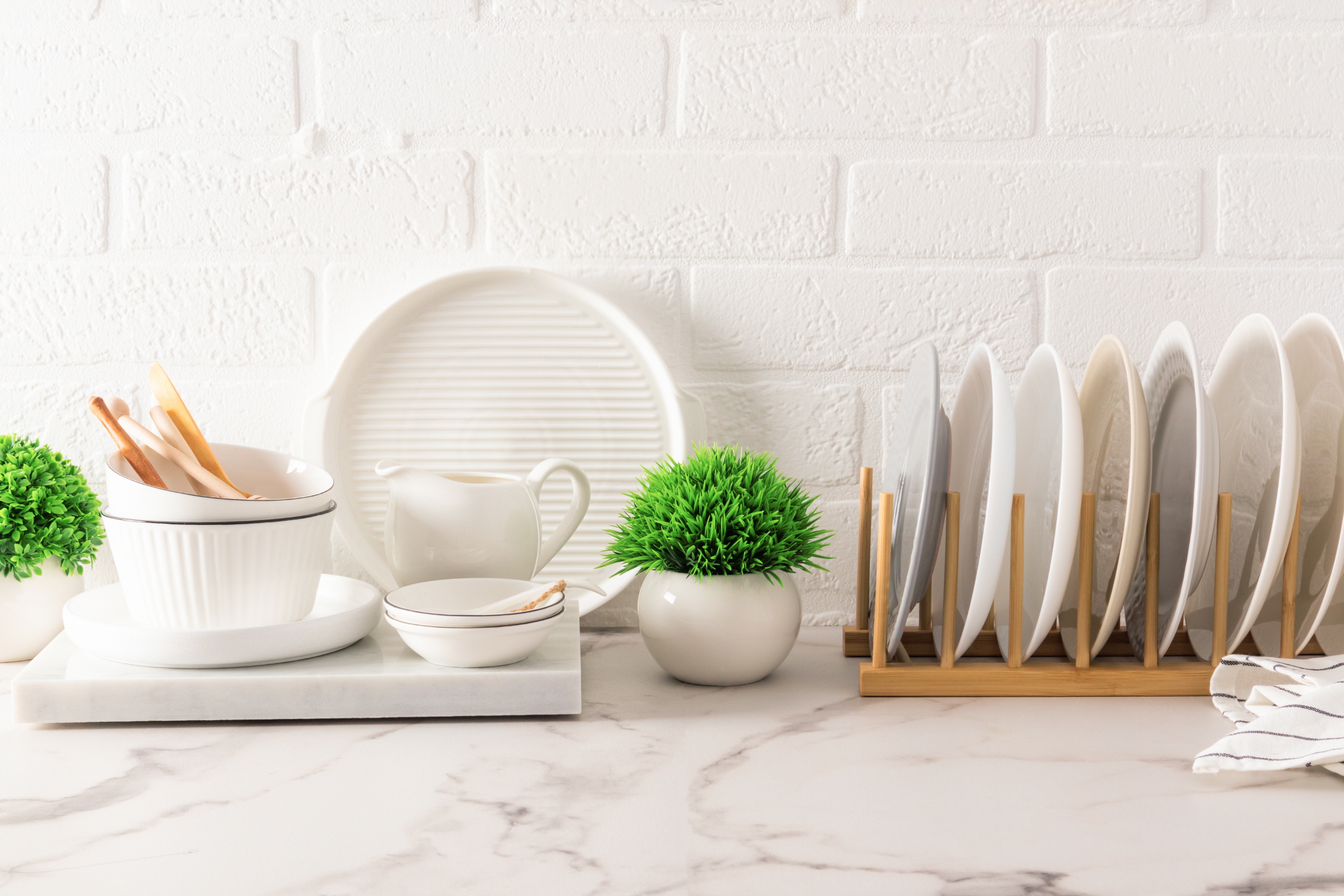 LX Hausys countertops showcase glassware, brightening the kitchen with style.