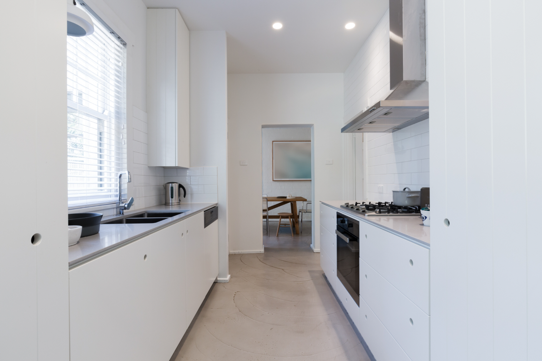 The Double Galley kitchen consists of two parallel walls, with a walkway in between, making it a highly efficient and functional layout.